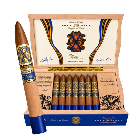 Open box of Fuentes OpusX cigars with a single cigar displayed, featuring intricate branding and design.
